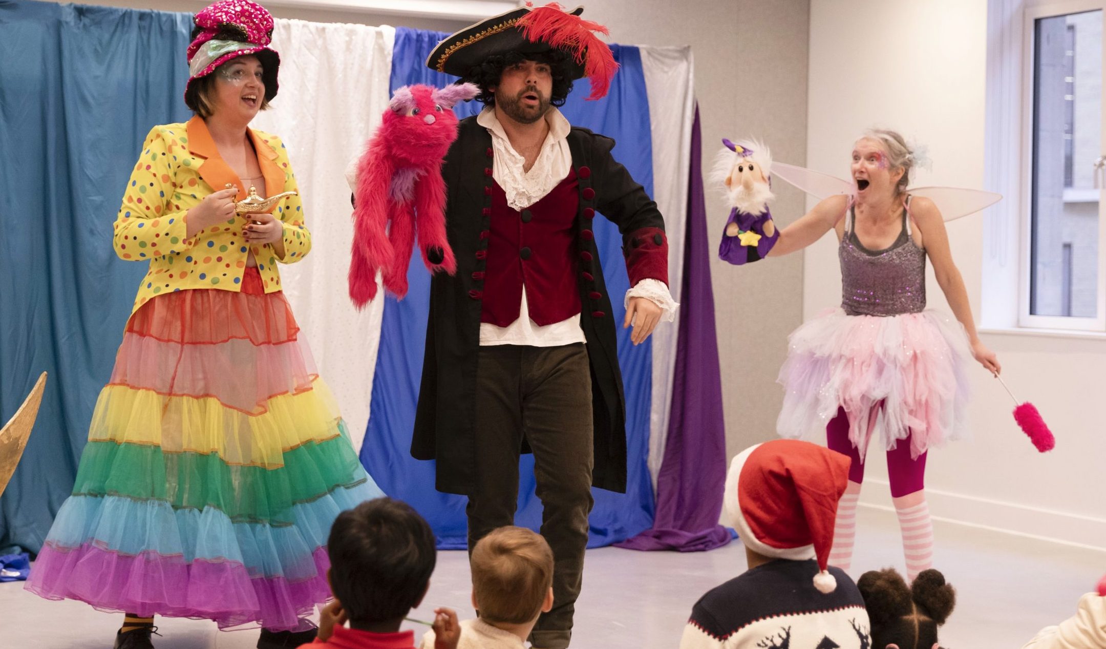 The Bedlam Bunch children's entertainers perform for the kids in this pantomime at a corporate Christmas party in London